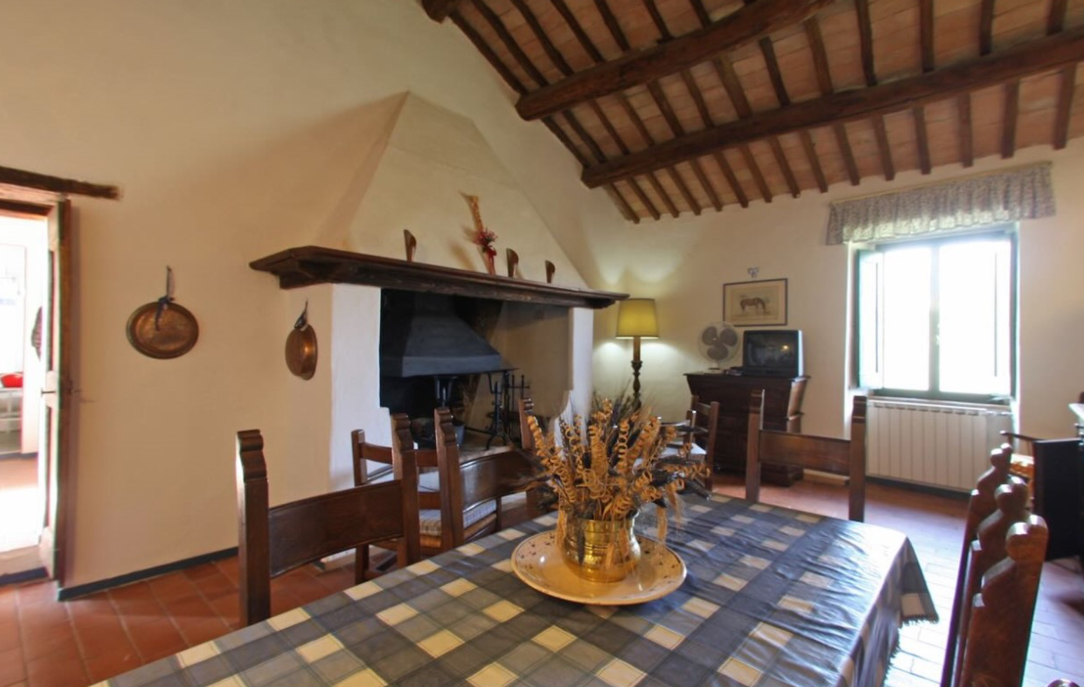 Stay Dining room with fireplace and wooden table