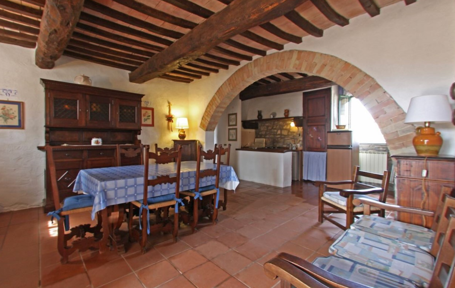 Stay Dining area with stone arch and wooden furniture
