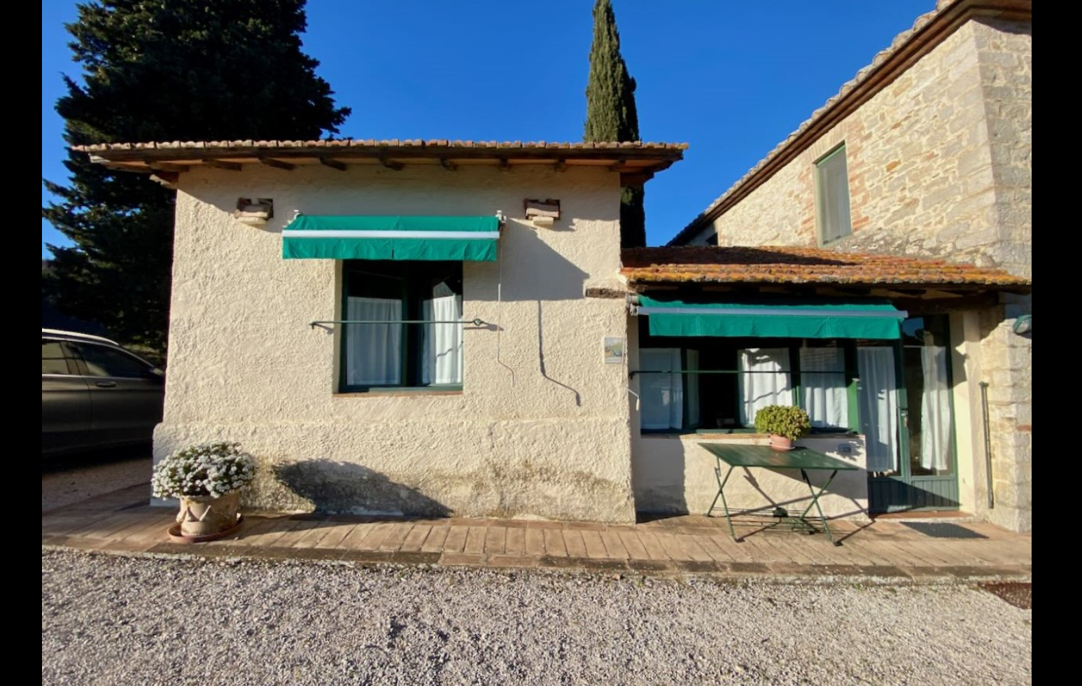 Stay Stone cottage with green awnings