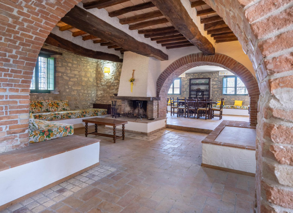 Living room with stone arches and fireplace