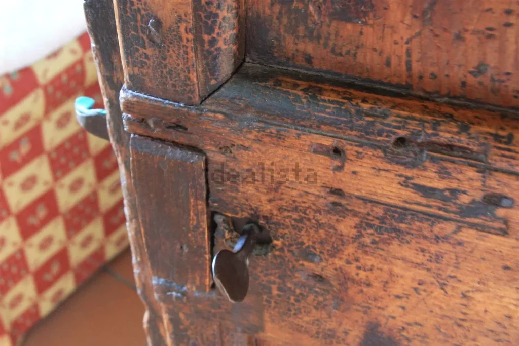 Detail of an old wooden door with iron fittings