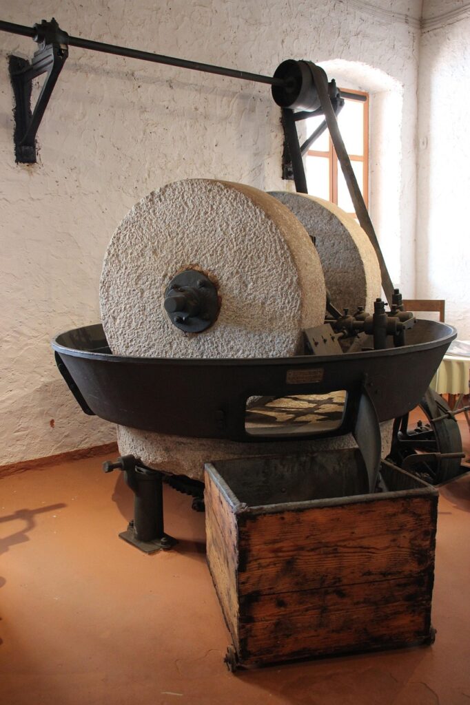 Old olive press with stone millstones