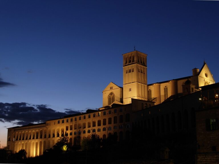 The Basilica di San Francesco in Assisi, illuminated in the evening