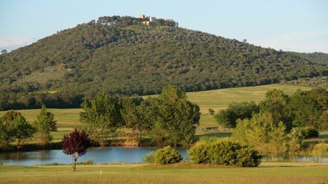 Golf Club Lamborghini near Panicale, with a pond and a hill town in the background