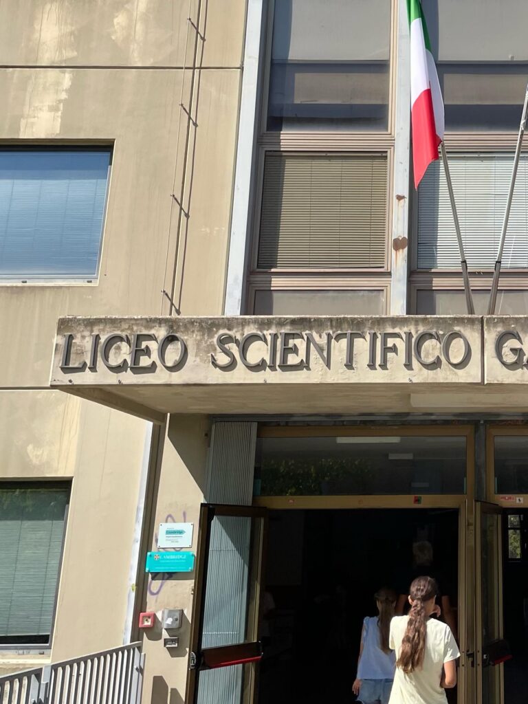 Entrance of an Italian secondary school with the Italian flag