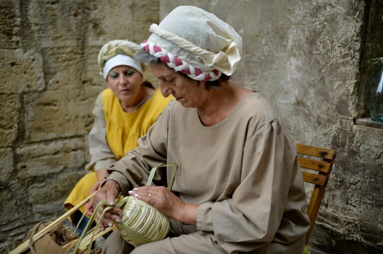 Craftsmen in medieval clothing during the Mercato delle Gaite in Bevagna